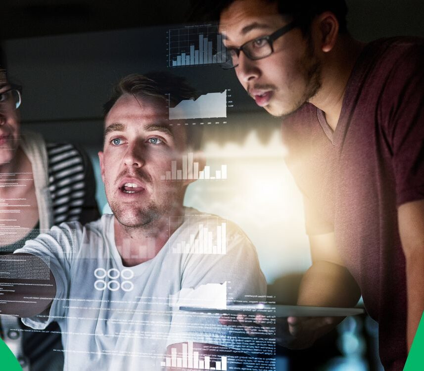 Group of people working in the tourism/travel industry collaborating around a large screen displaying complex data visualizations, representing the application of big data and real-time intelligence.