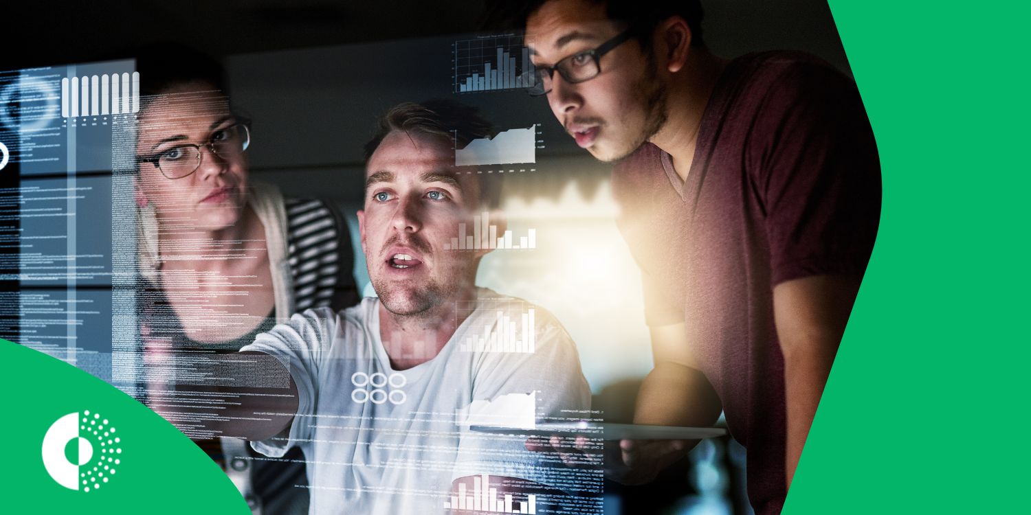 Group of people working in the tourism/travel industry collaborating around a large screen displaying complex data visualizations, representing the application of big data and real-time intelligence.